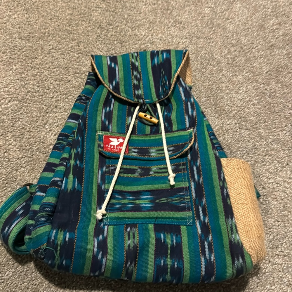 Taa Luma backpack in green and blue looks brand new